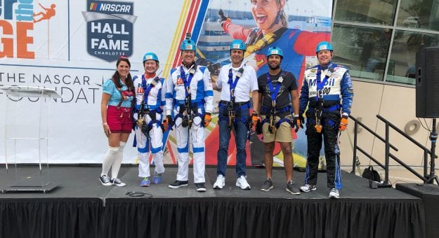 Visit Over the Edge Features VIPs from NASCAR, Charlotte Community Rappelling Over Embassy Suites Charlotte Uptown  To Help Children in the Local Charlotte Community page
