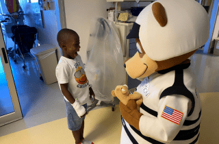 Child receiving Speedy Bear